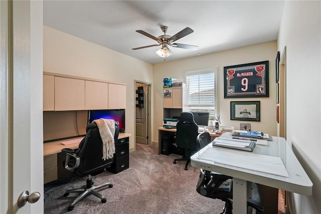 carpeted office with ceiling fan