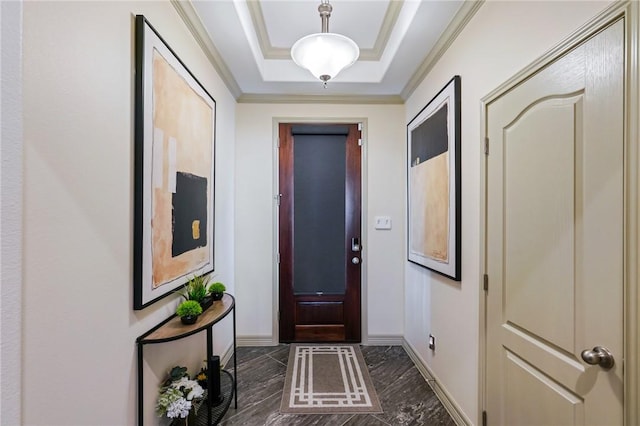 doorway to outside with a raised ceiling and crown molding