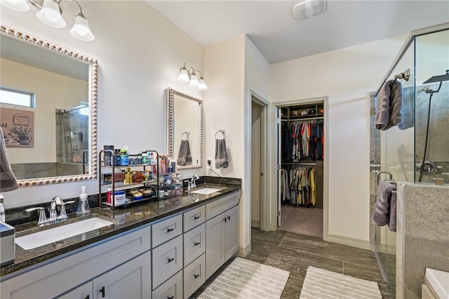 bathroom with vanity and an enclosed shower