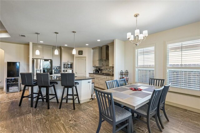 dining space featuring a notable chandelier