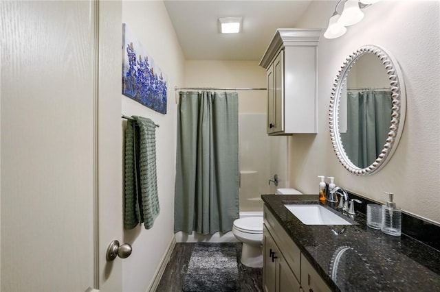 full bathroom featuring vanity, shower / bath combo, and toilet