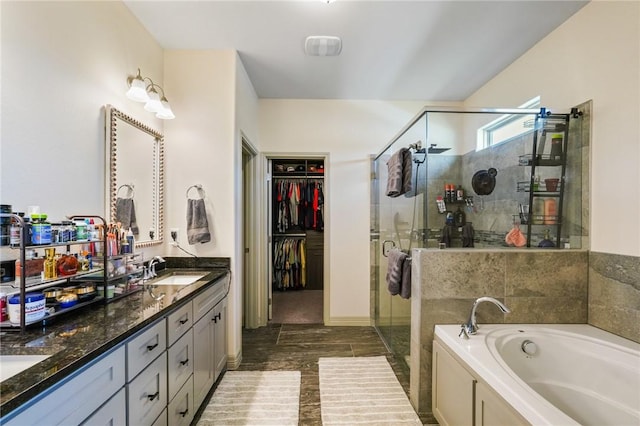 bathroom with vanity and plus walk in shower