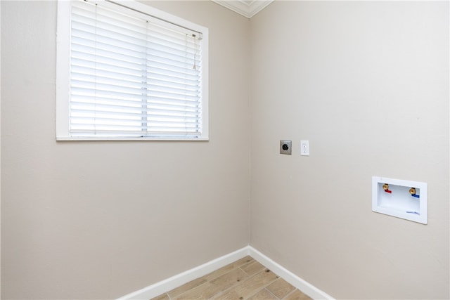 washroom featuring ornamental molding, electric dryer hookup, hookup for a washing machine, and wood-type flooring