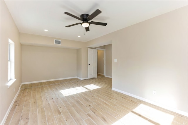 spare room featuring ceiling fan and light hardwood / wood-style flooring