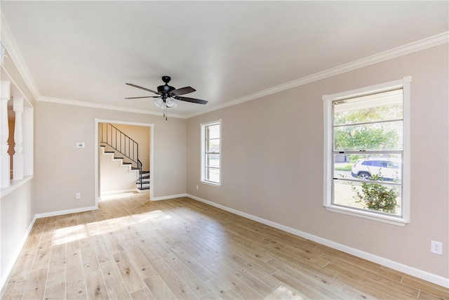 unfurnished room with light hardwood / wood-style flooring, ceiling fan, and plenty of natural light