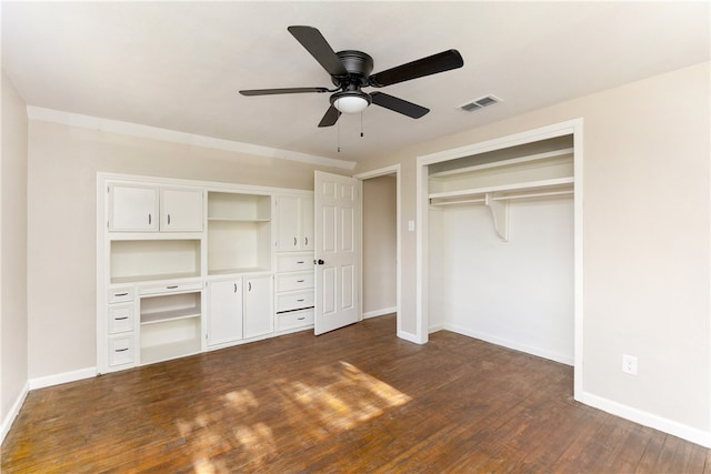 unfurnished bedroom with dark hardwood / wood-style flooring and ceiling fan