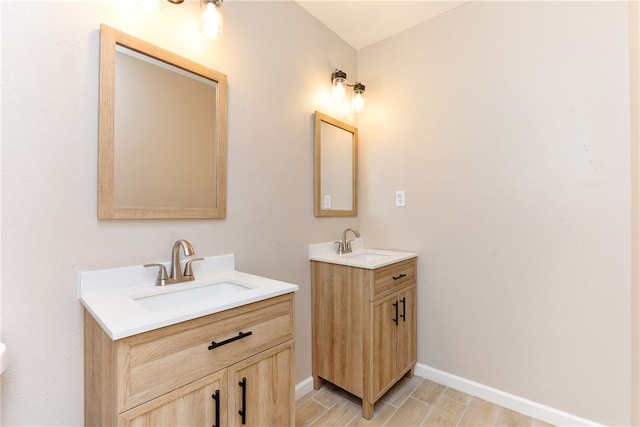 bathroom with hardwood / wood-style floors and vanity