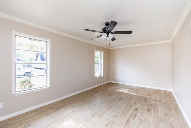 empty room with light hardwood / wood-style flooring, ornamental molding, and plenty of natural light