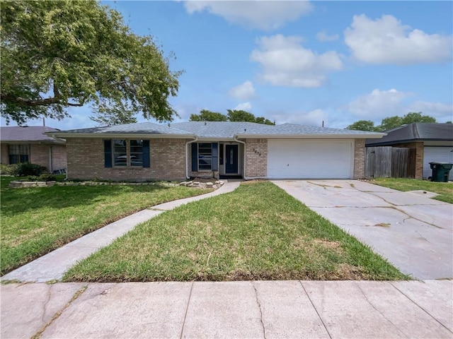 3658 Braeburn Dr, Corpus Christi, TX 78415 - ranch-style house featuring a garage, concrete driveway, a front lawn, and brick siding