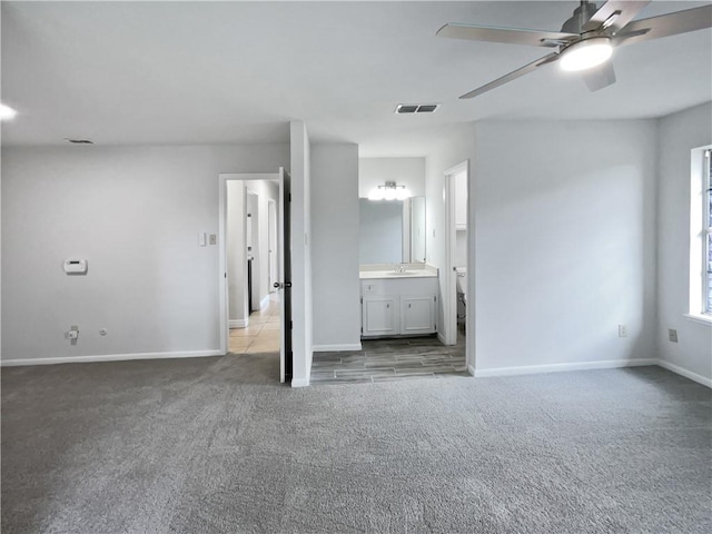 3658 Braeburn Dr, Corpus Christi, TX 78415 - unfurnished bedroom featuring a sink, baseboards, carpet, and visible vents