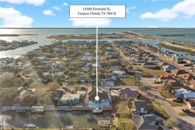 bird's eye view featuring a water view and a residential view