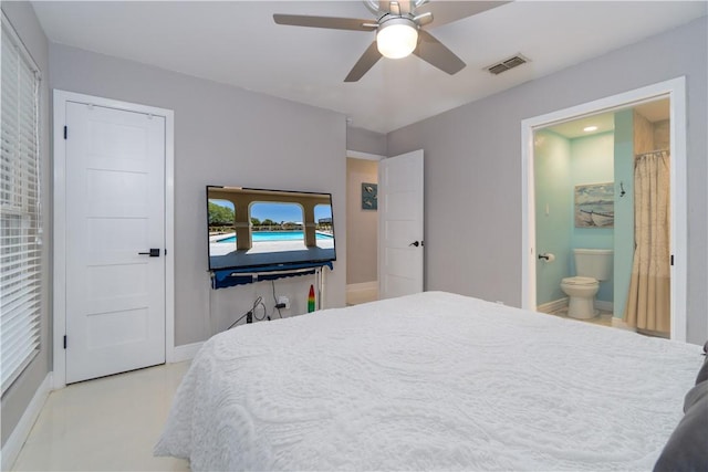 bedroom featuring ensuite bath, baseboards, visible vents, and ceiling fan