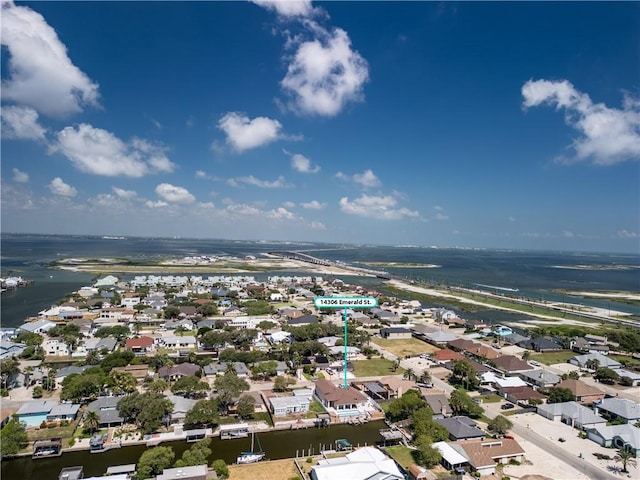 drone / aerial view featuring a residential view and a water view