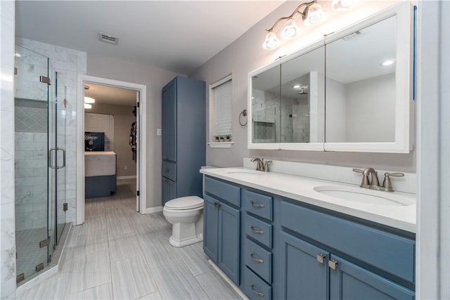 full bathroom with double vanity, a sink, visible vents, and a shower stall