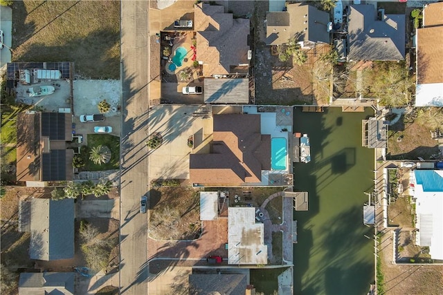 birds eye view of property with a residential view