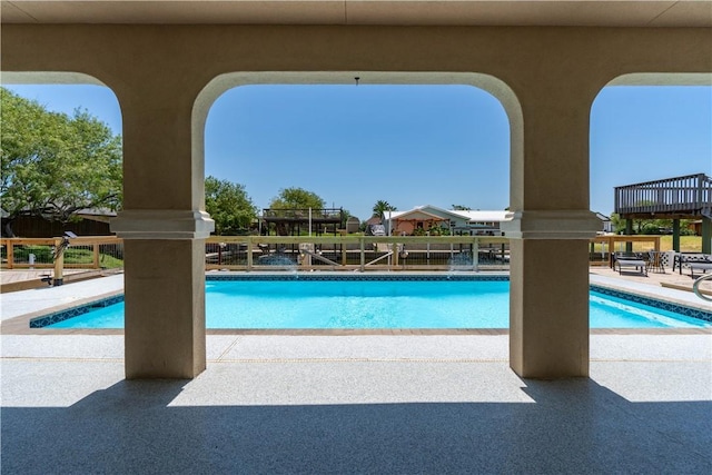 outdoor pool featuring a patio area