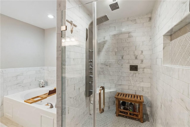 full bath with tile walls, a bath, a stall shower, and tile patterned floors