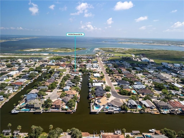 drone / aerial view with a water view and a residential view