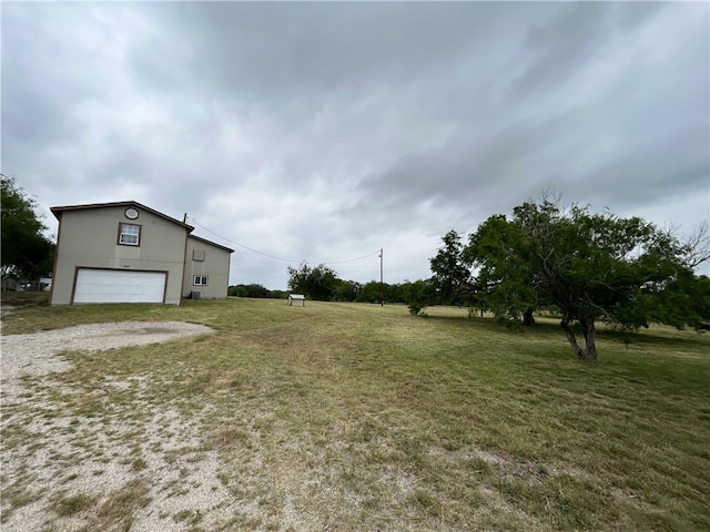 view of yard with a garage