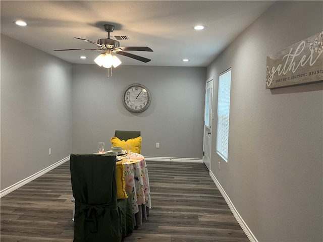 dining area featuring ceiling fan and dark hardwood / wood-style flooring