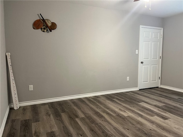 unfurnished room with ceiling fan and dark hardwood / wood-style floors