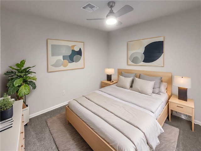 carpeted bedroom with a ceiling fan, visible vents, and baseboards