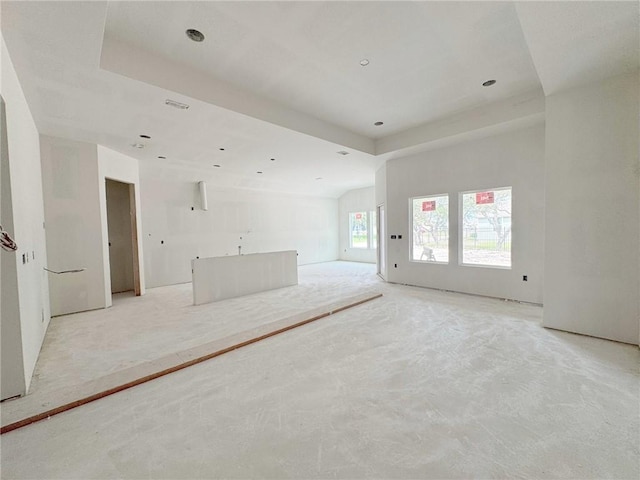 101 Broad Oak Dr, Rockport, TX 78382 - unfurnished living room with a raised ceiling and light colored carpet