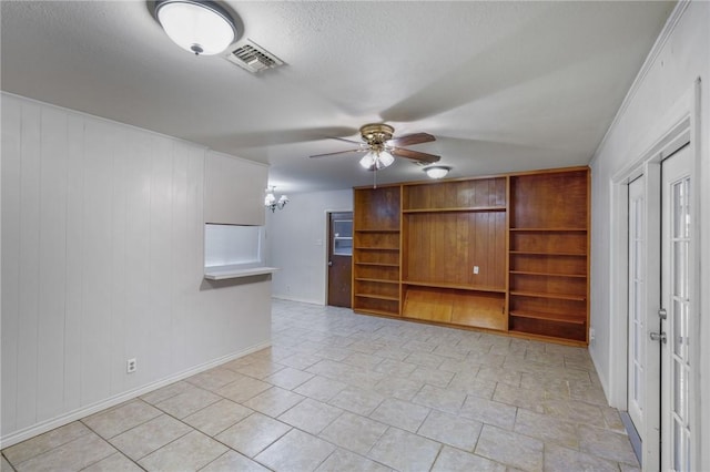 bonus room featuring a textured ceiling and ceiling fan