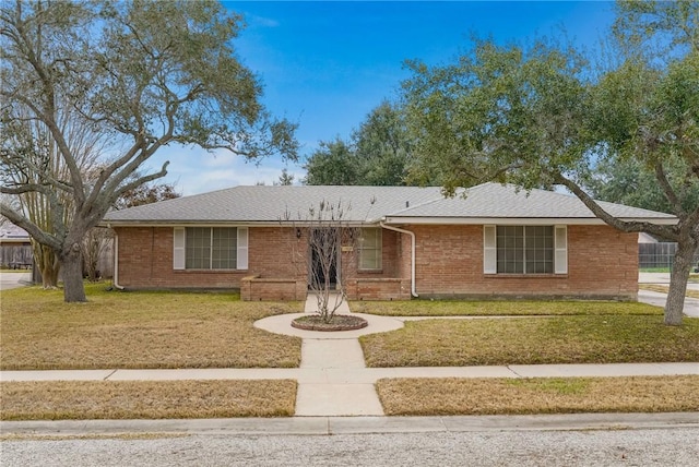 single story home featuring a front yard