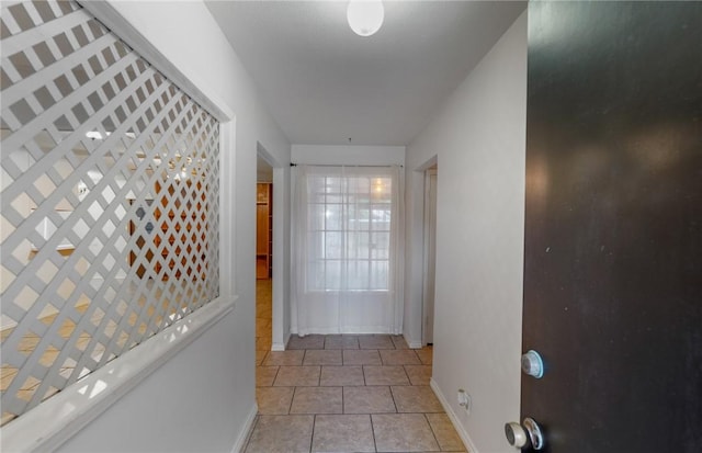 corridor featuring light tile patterned flooring