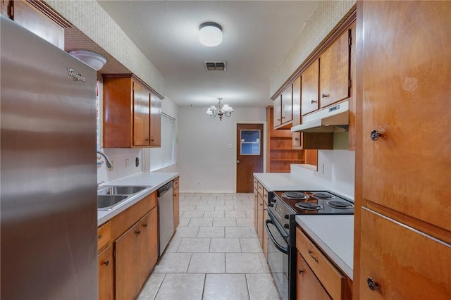 kitchen featuring sink, light tile patterned floors, appliances with stainless steel finishes, a notable chandelier, and pendant lighting