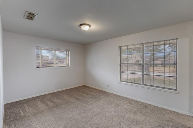 empty room featuring carpet floors