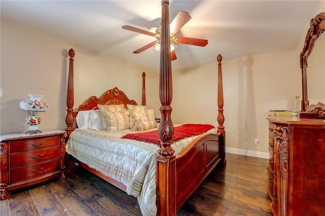 bedroom with dark wood-type flooring, ceiling fan, and baseboards