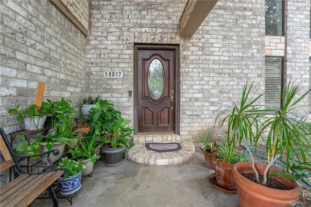 entrance to property with brick siding