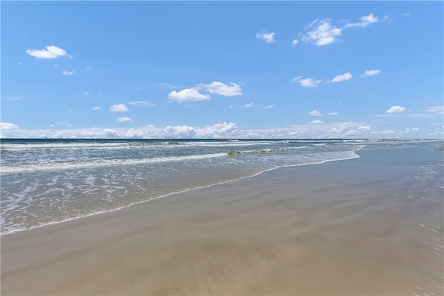 view of water feature with a beach view