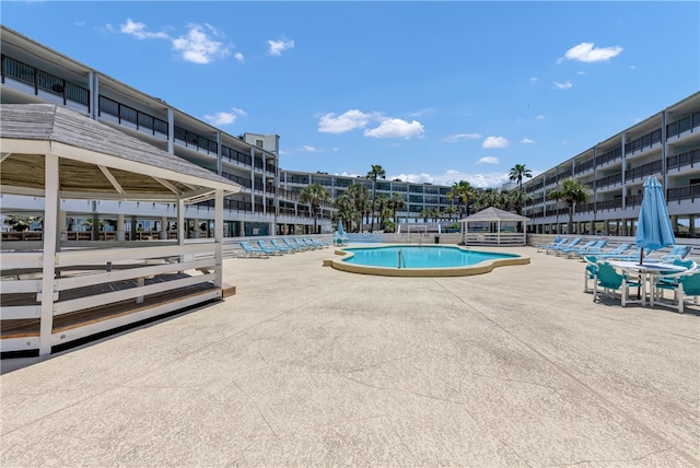 view of swimming pool with a patio