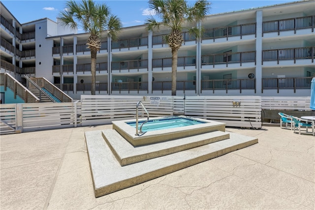 view of pool featuring a hot tub