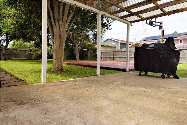 view of patio with grilling area and a pergola