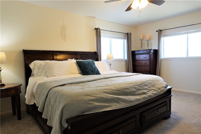 bedroom with carpet, multiple windows, and ceiling fan