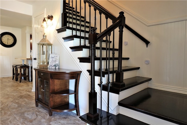 stairway with crown molding