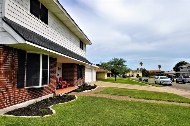 view of yard featuring a garage