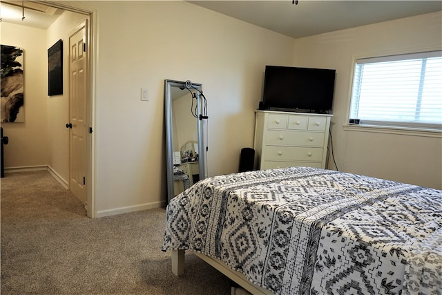 bedroom featuring light carpet