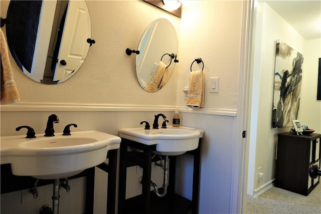 bathroom with dual sinks