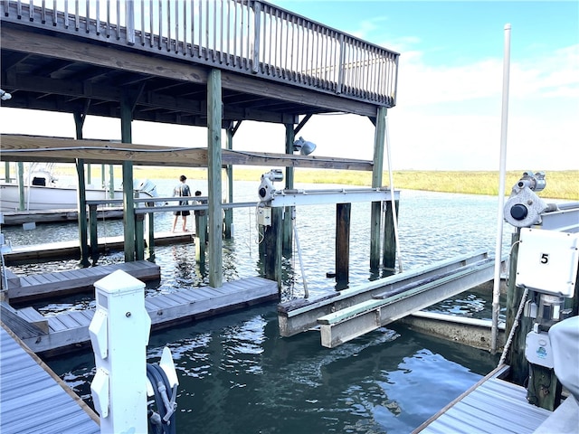 14890 Granada Dr Unit 102, Corpus Christi, TX 78418 - dock area featuring boat lift and a water view