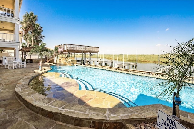 14890 Granada Dr Unit 102, Corpus Christi, TX 78418 - community pool featuring a water view and a patio area