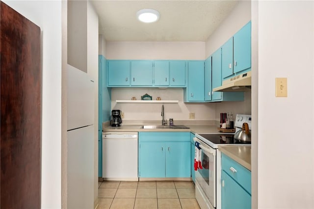 715 S Upper Broadway St Unit 404, Corpus Christi, TX 78401 - kitchen featuring white appliances, blue cabinetry, under cabinet range hood, and light tile patterned floors