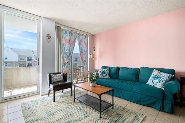 715 S Upper Broadway St Unit 404, Corpus Christi, TX 78401 - living area featuring tile patterned flooring and a textured ceiling