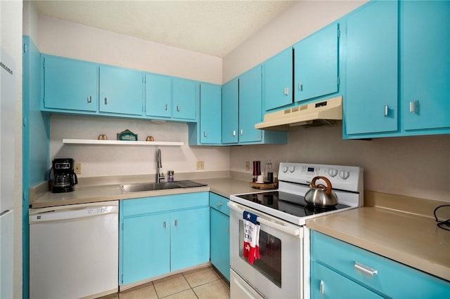 715 S Upper Broadway St Unit 404, Corpus Christi, TX 78401 - kitchen with white appliances, under cabinet range hood, blue cabinetry, and open shelves