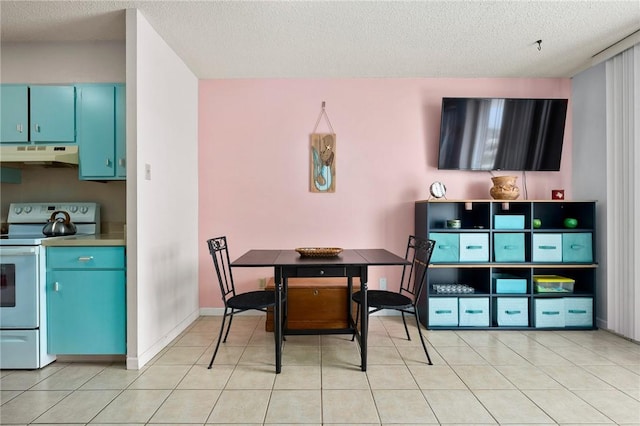 715 S Upper Broadway St Unit 404, Corpus Christi, TX 78401 - dining space with a textured ceiling and light tile patterned floors