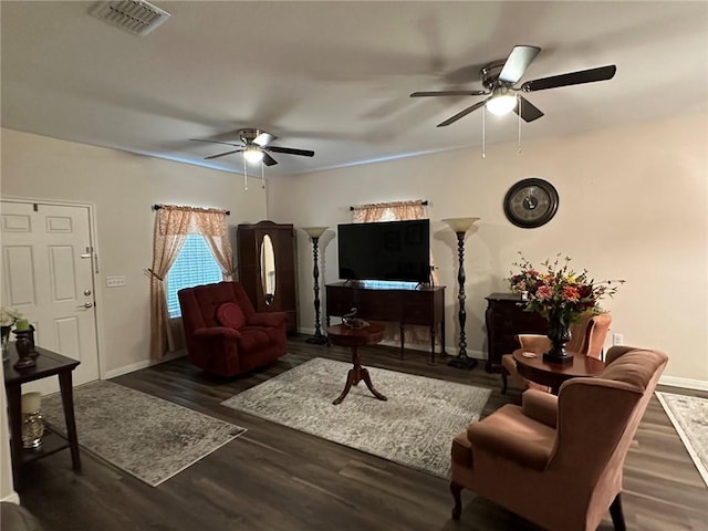 803 Molina St, Robstown, TX 78380 - living room featuring ceiling fan, baseboards, and wood finished floors